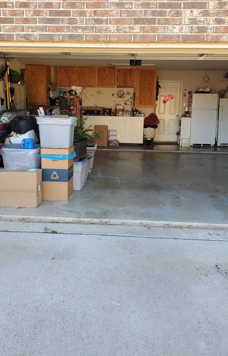 Garage with boxes, storage bins and appliances from the original Aledo Junk Removal photo collection